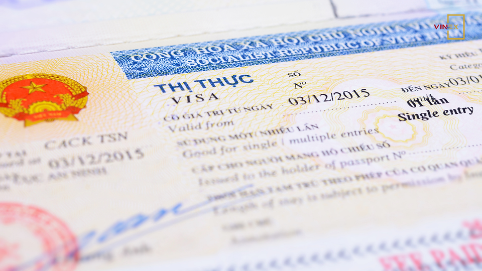 Close-up image of a Vietnamese visa document featuring the national emblem, security watermark, and official details. This image visually represents Vietnam’s shift toward digital administrative identification and e-ID systems.