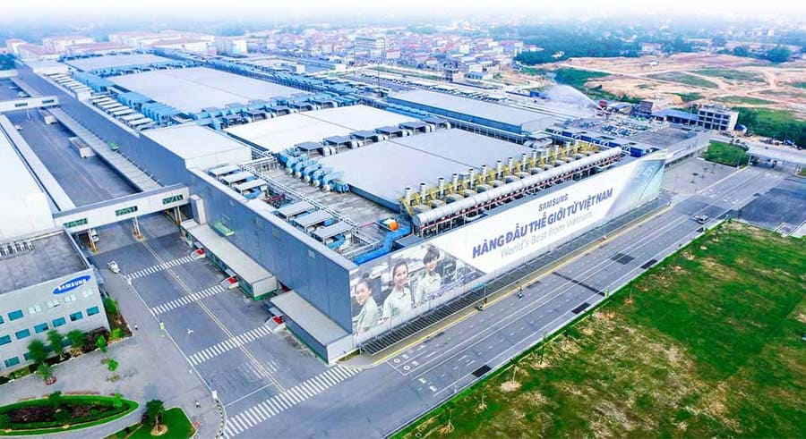 An aerial view of a modern industrial manufacturing complex in Vietnam, representing economic development and large-scale production capacity.