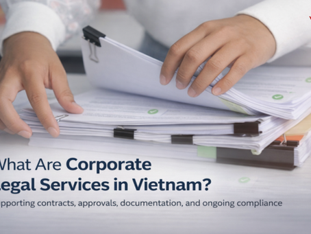 Hands reviewing business documents to illustrate corporate legal services in Vietnam, including contracts, approvals, documentation, and ongoing compliance.