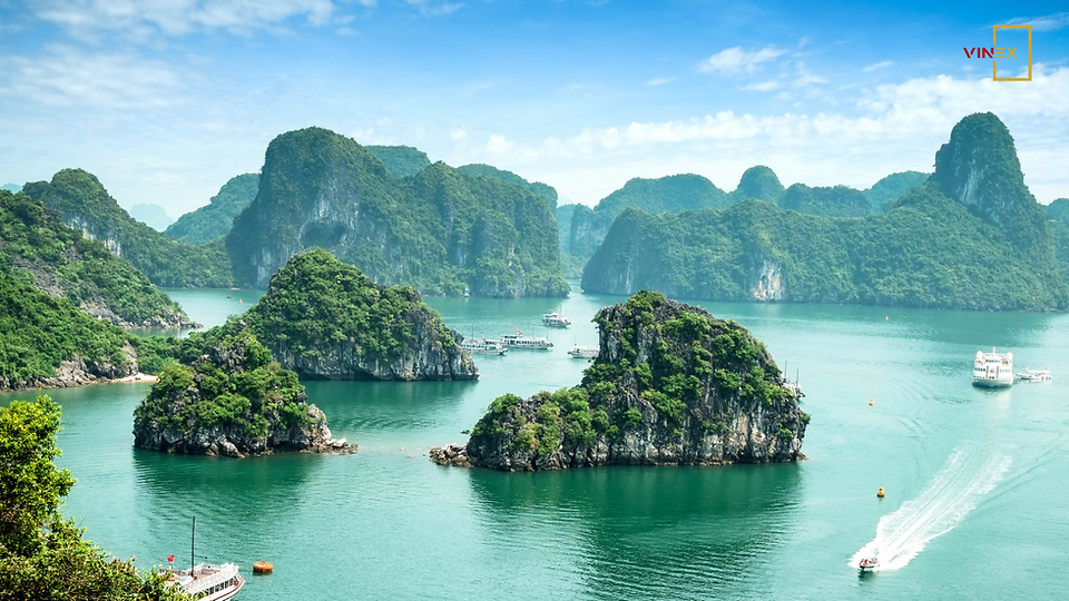 Aerial view of Ha Long Bay, Vietnam, showcasing limestone islands, turquoise water, and cruise ships — symbolizing Vietnam’s thriving tourism industry in 2025.