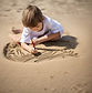child writing in sand.jpg