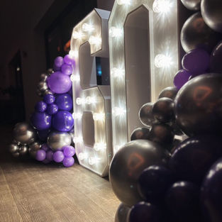 Large LED light up number 60 at a birthday party in Kent with balloon display 