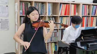 Patrick Lam Teaching Student Violin.jpeg