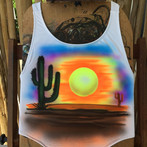 A desert sunset and cactus airbrushed on a shirt. Airbrush on white apparel. An Arizona desert scene sunset in contrast to the wet pool or beach where the swimsuit will be worn.
