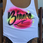 Graffiti and pop art airbrush text on t-shirts, swimsuits, dresses and sweatshirts for fashion shows and corporate events.Graffiti Pop Events - Airbrush Artists, 305-918-2975, info@graffiti-pop.com, www.graffiti-pop.com