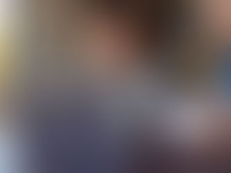 A boy sitting in front of a computer