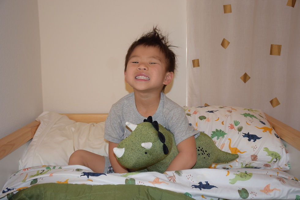 Four-year-old Baby J and Dino the dinosaur.