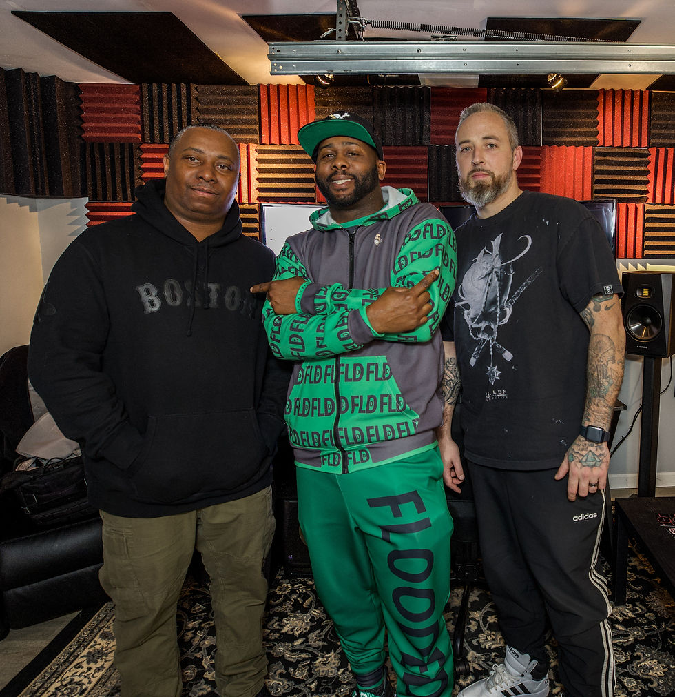 Studio interaction between Smyly Sickwitit, Mann Terror, and Rockwood Productions highlighting creative friendship.