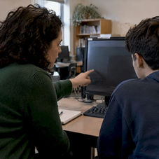 Counselor showing a student their school platform