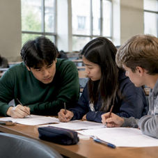 High school students solving tournament math problems
