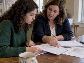 Student and parent comparing college credit records