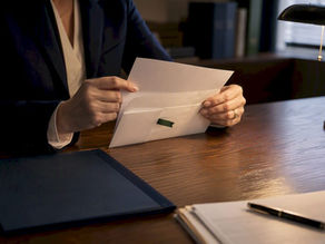 Admissions counselor reviewing formal likely letter