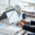 side-view-cropped-unrecognizable-business-people-working-common-desk_edited.jpg
