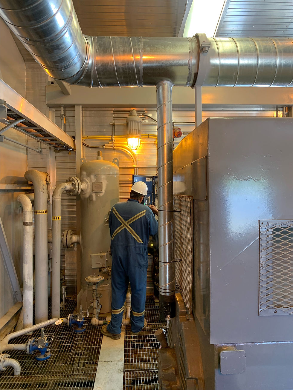 A Technician working on a Ventilation System