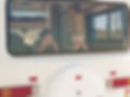 Boy and Girl in the Campervan Window