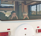 Boy and Girl in the Campervan Window