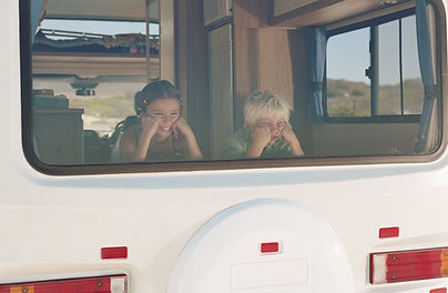 Boy and Girl in the Campervan Window