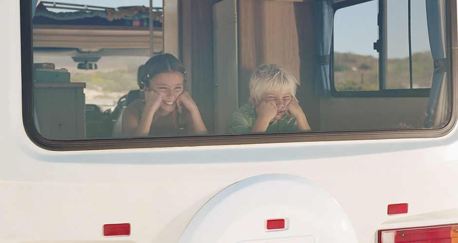 Boy and Girl in the Campervan Window