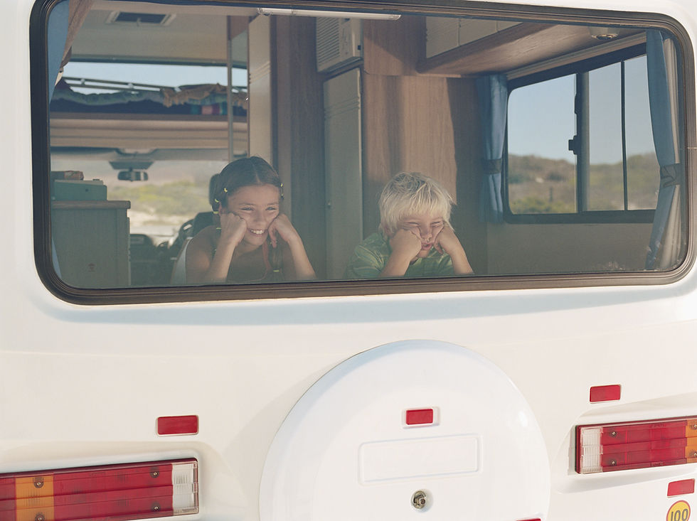 Boy and Girl in the Campervan Window