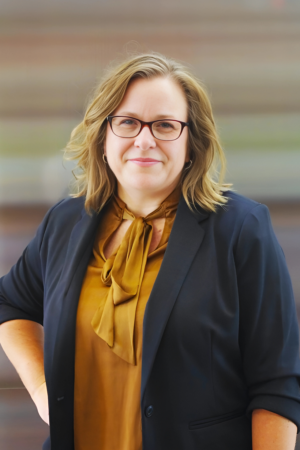 Cheramie Dankesreiter, litigation paralegal, smiling confidently in a professional headshot.