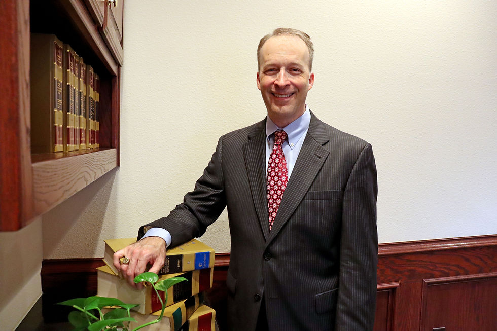 Phillip M. Herr, attorney and former associate judge, in a professional headshot wearing business attire.
