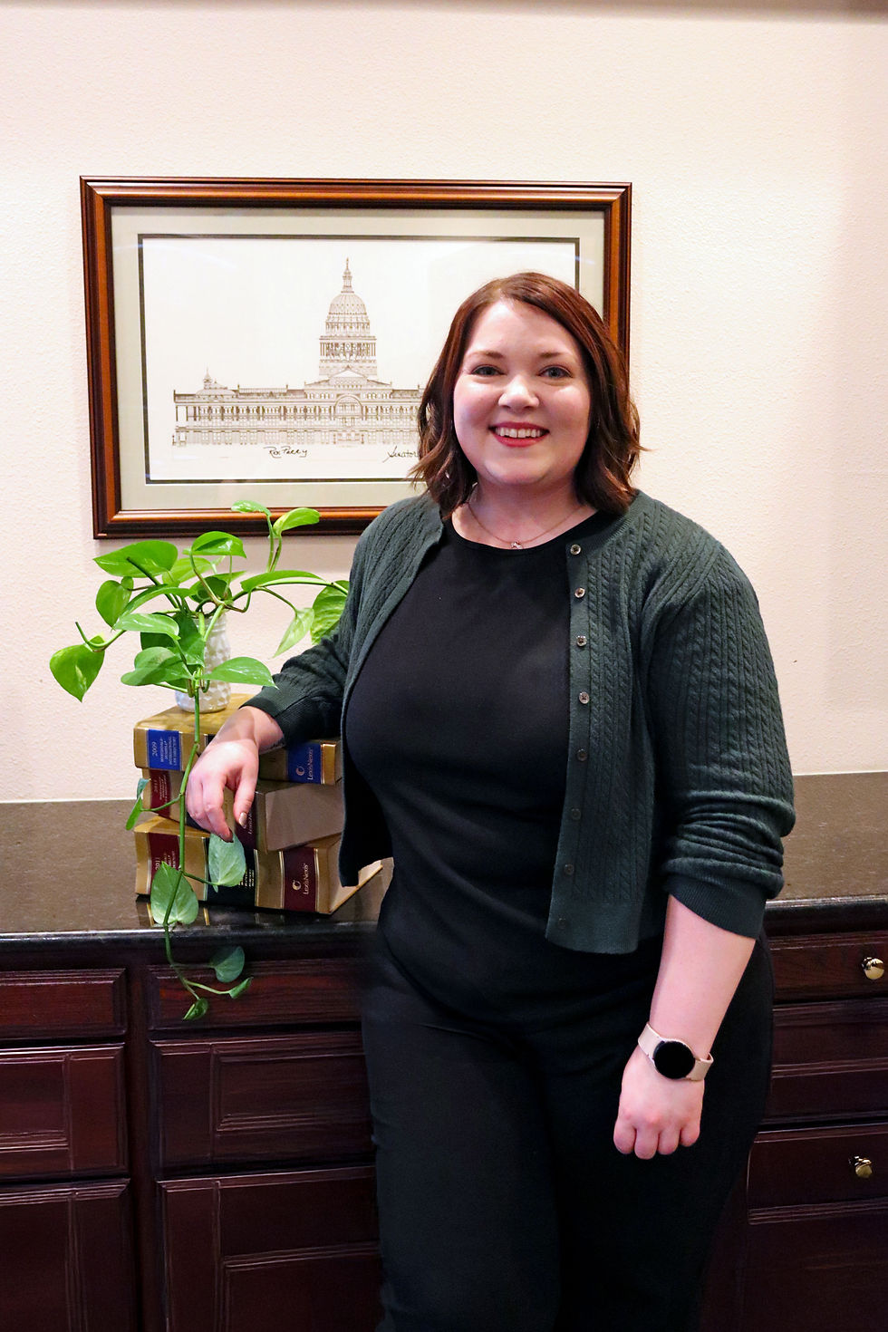 Professional portrait of Kayla, with a background in economics and medical marketing.