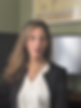 Juliana Adelman, lawyer, smiling confidently in a professional photograph.