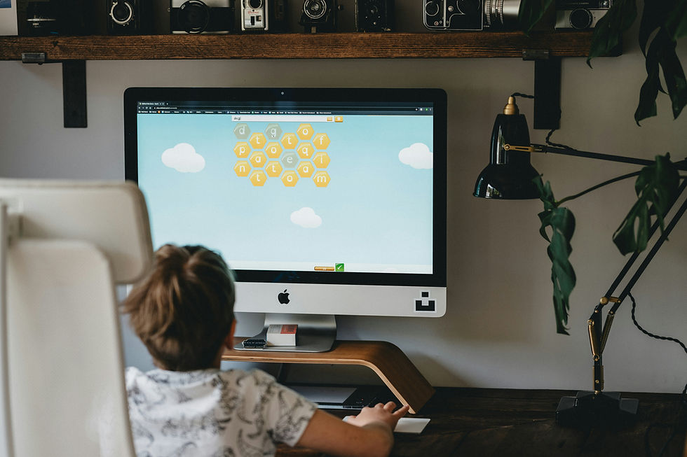 French immersion student playing an online phonics and vocabulary game during a reading session