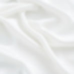 Soft, smooth and plush white fabric that is thin and flowing..jpg