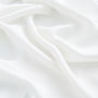 Soft, smooth and plush white fabric that is thin and flowing..jpg