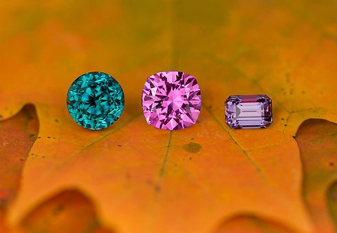 Custom cut, rare gems: grandidierite, pink sapphire, and alexandrite
