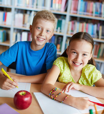 cheerful-friends-doing-homework.jpg