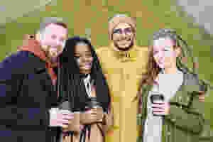 A group of friends having coffee in the park