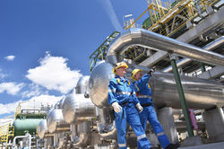 group of industrial workers in a refiner