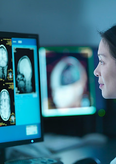 Doctor Analyzing Scans