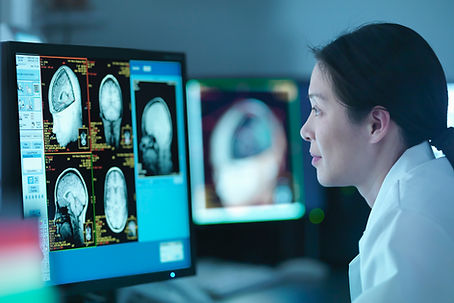 Doctor analyzing brain scans