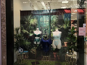 Lingerie boutique with blue, green, and aqua on the mannequins