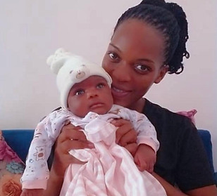 Nusura with her baby.jpeg