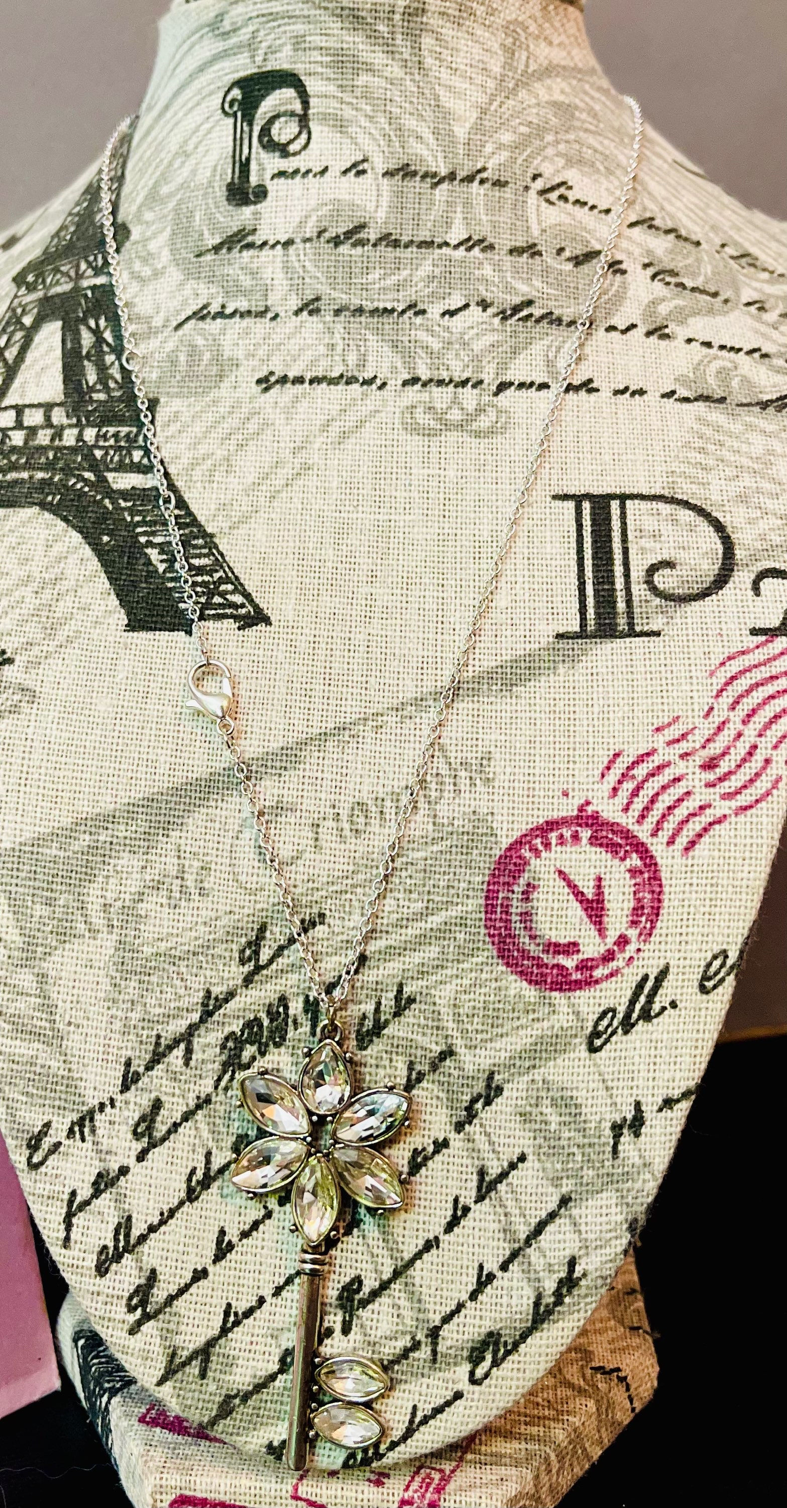 Key shaped necklace with Sparkly Flower Design 