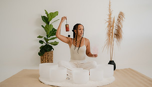 One-on-one sound bath session with crystal singing bowls in a calming home setting.