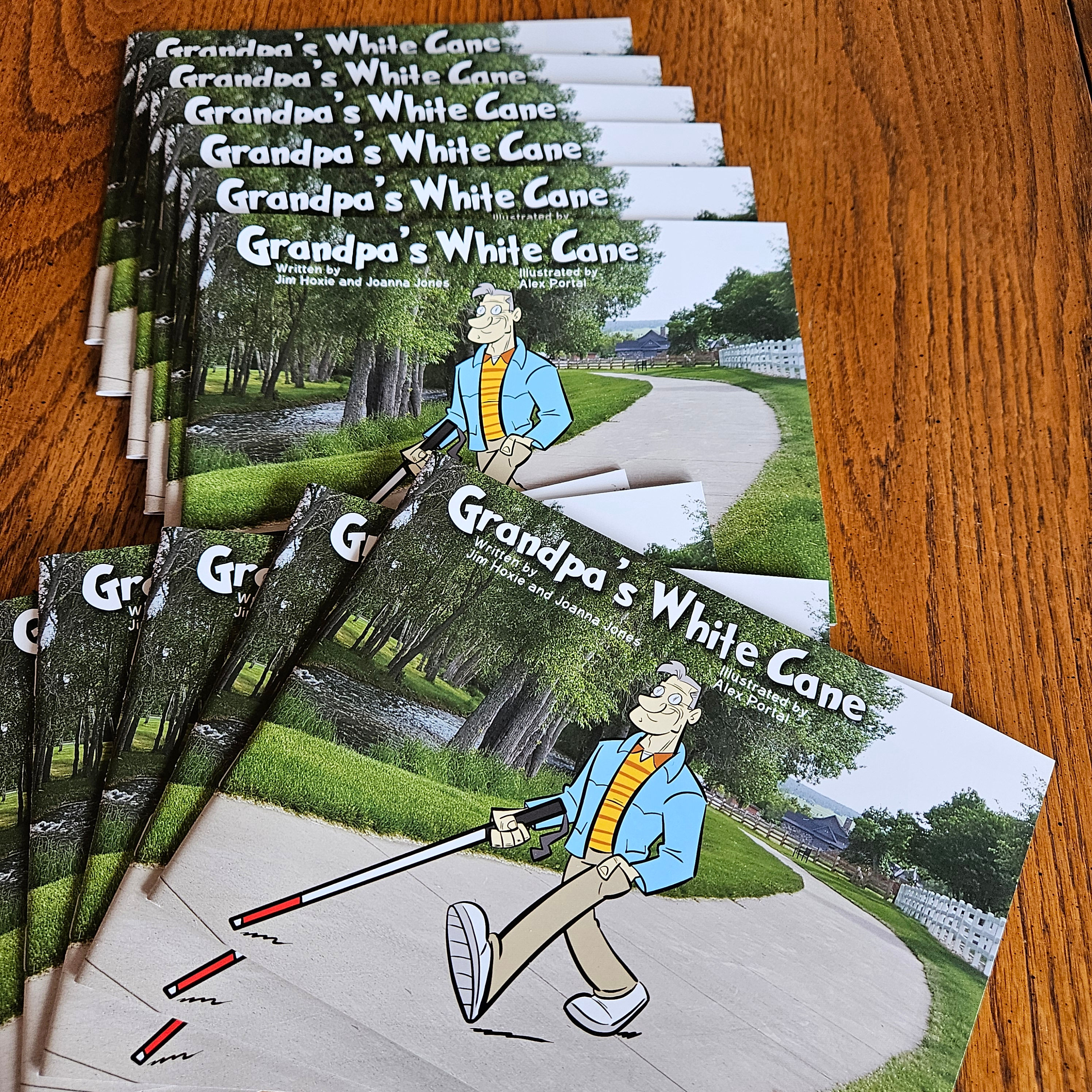 Stack of Grandpa's White Cane Hardback Books on a wooden table