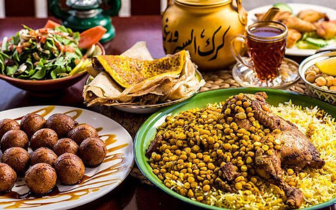 A delectable spread of Emirati cuisine, featuring dishes like grilled meats, aromatic rice, flavorful spices, and traditional bread, highlighting the rich and diverse flavors of the United Arab Emirates.