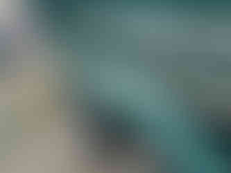 Sea Ray hull showing temporary gloss improvement after light correction