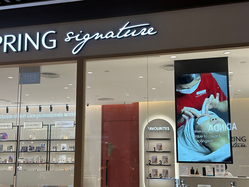 Vertical hanging digital display at AsterSpring Signature storefront in Singapore