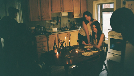 Characters being filmed in "It's Still Raw"