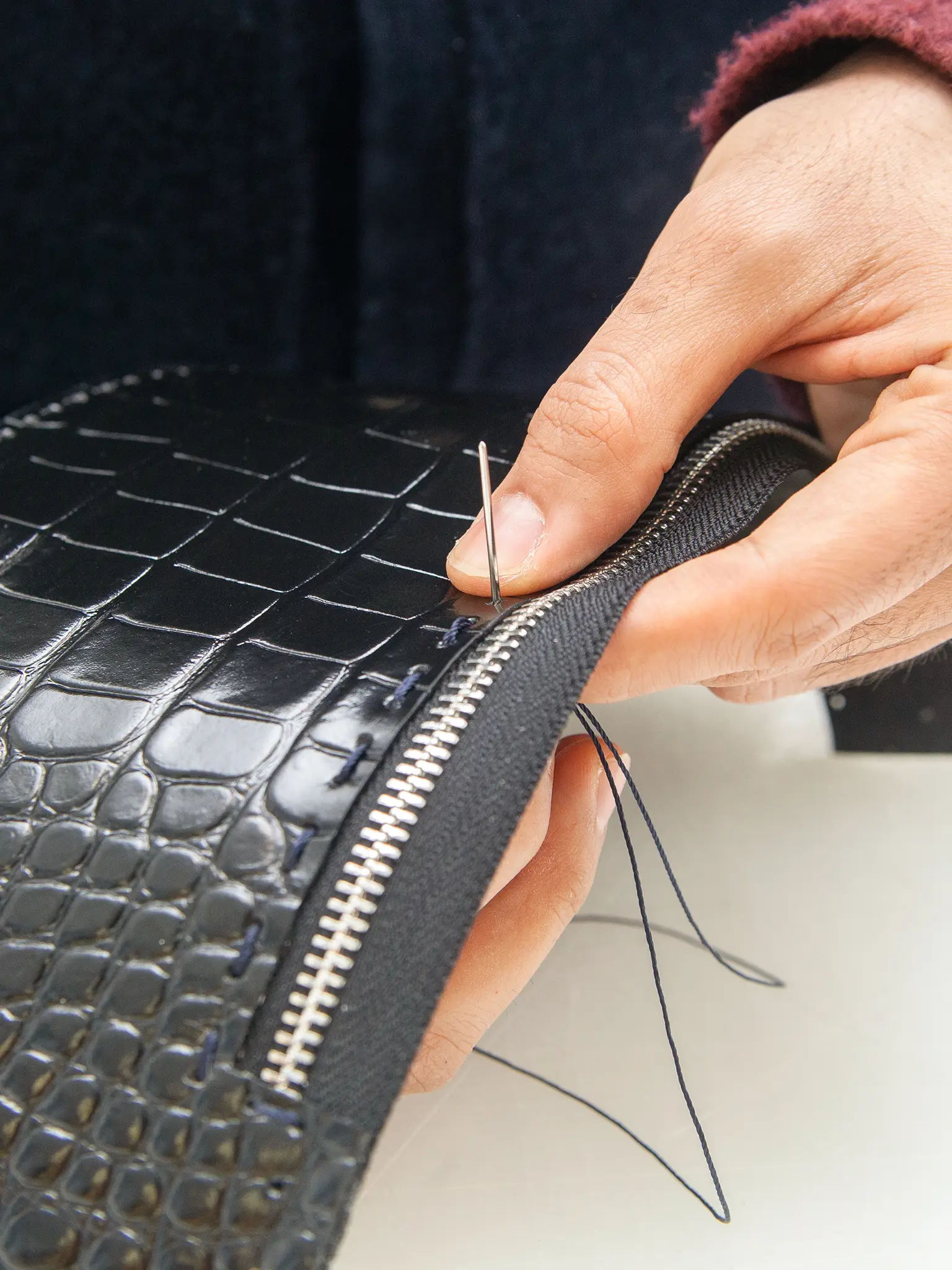 Florentine artisan hand stitching leather bag