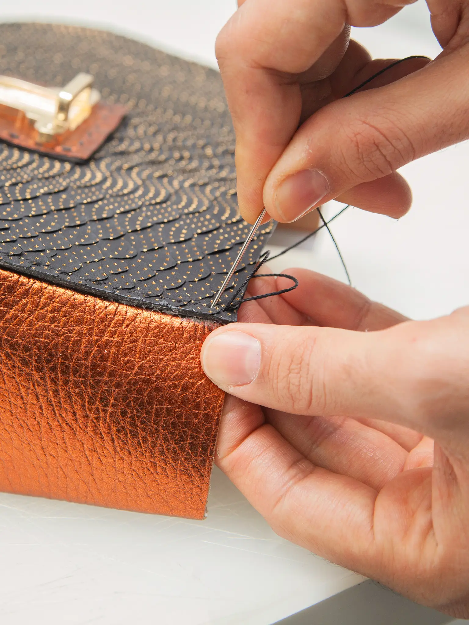 close up of the leather hand-stitching process