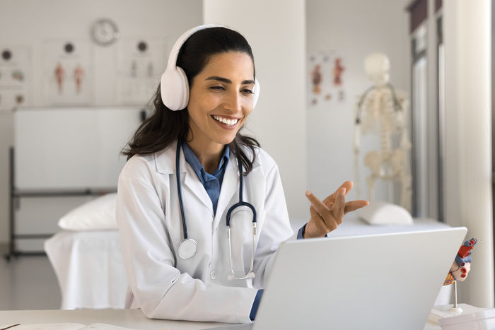 A medical professional answers an after hours call with a HIPAA compliant answering service.