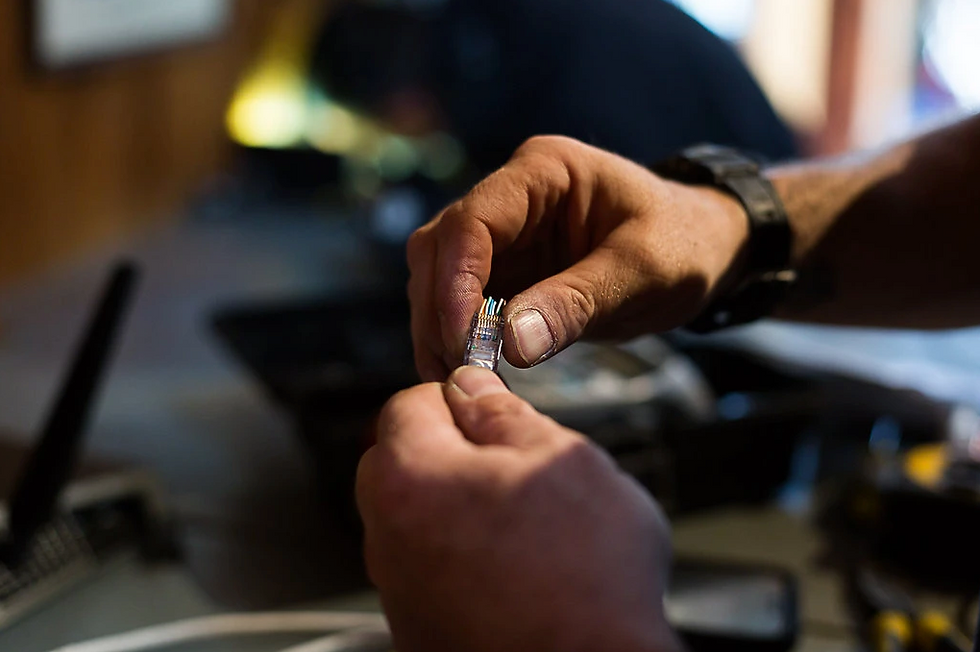 A residential electrician works on the wiring for a new home.