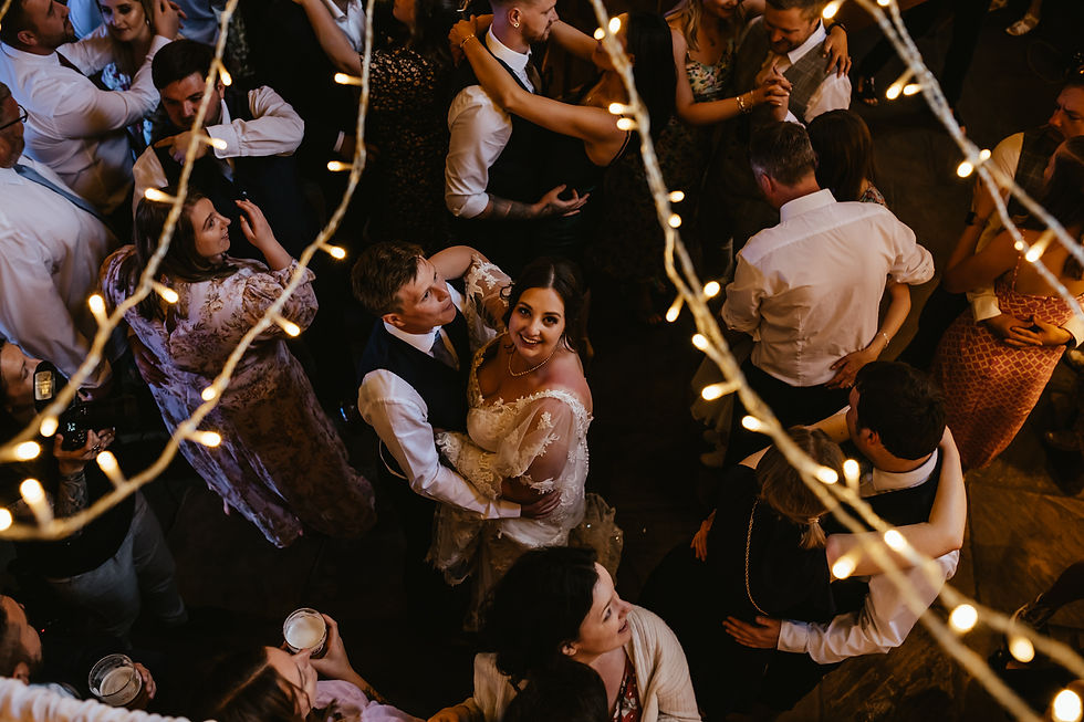 chaucerbarn-norfolk-birde-groom-dancing-with-guest-aj-feather-photogrpahy